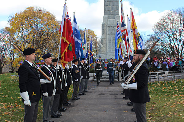 Remembrance Day Procession and military staff standing at attention