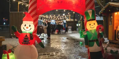 Christmas theme inflatable in front of market entrance