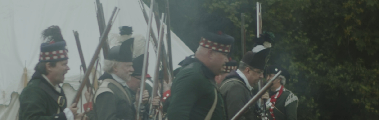 18th century soldiers carrying muskets.