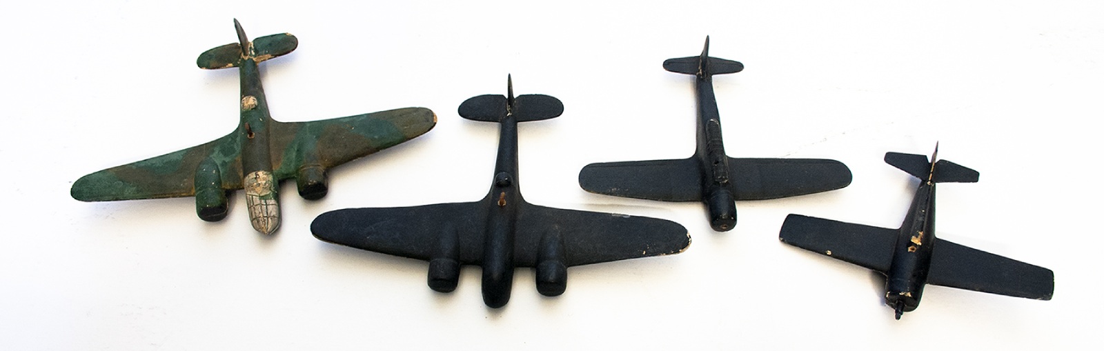 Four toy World war 2-era planes.