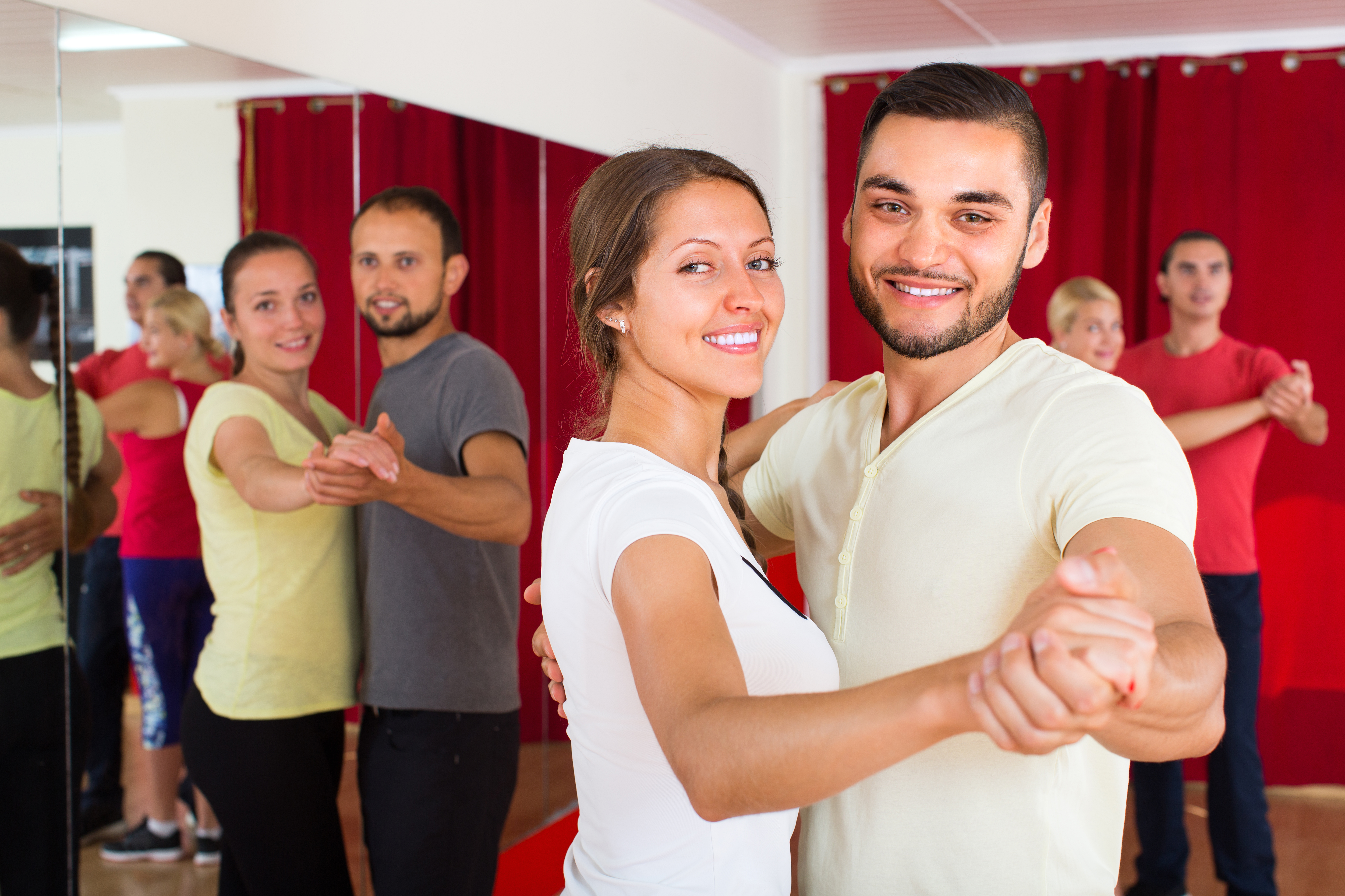 Adults in ballroom dance class