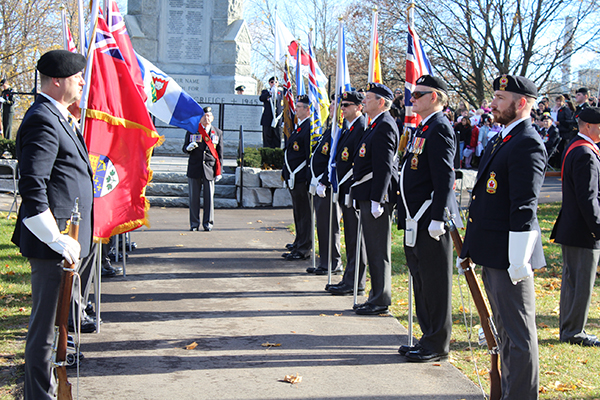 Men un uniform during Remembrance Day standing at attention