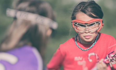 Girl playing Lacrosse