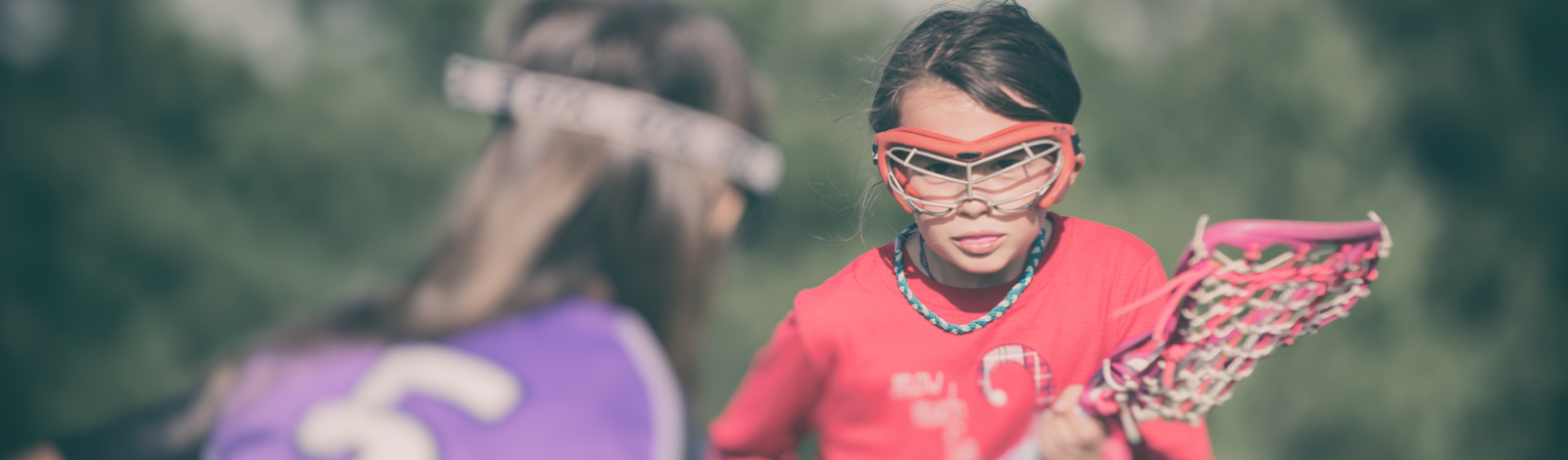 Girl playing Lacrosse