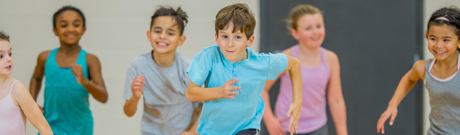 Kids running in gym