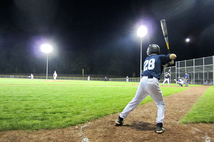Photo of kids playing baseball