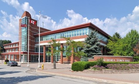 A modern red brick and glass building. 