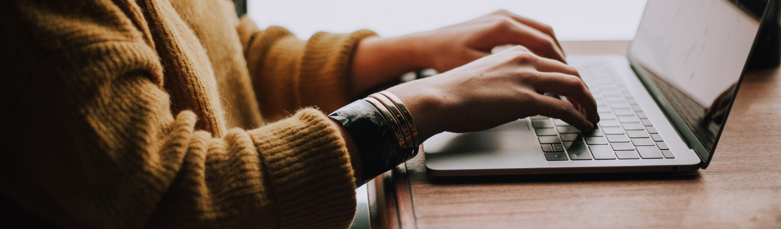 Typing on laptop computer