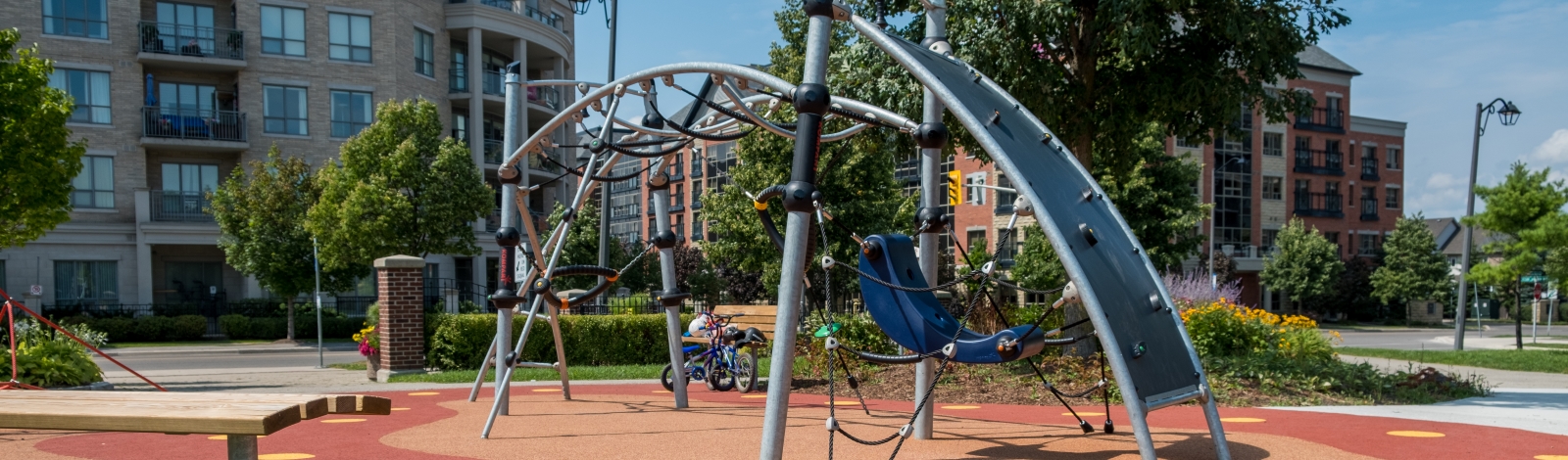 A playground with some apartments in the background