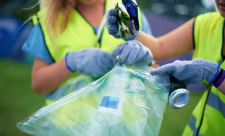 Hands sorting garbage