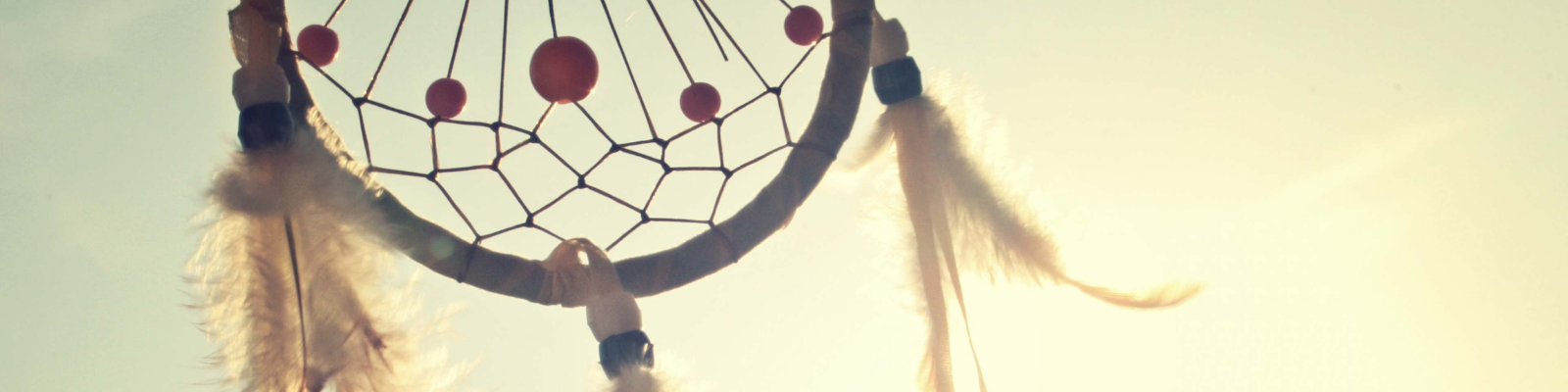 Dream catcher with sunlight behind it