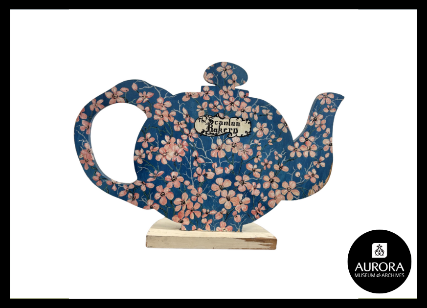 Blue teapot with pink flowers