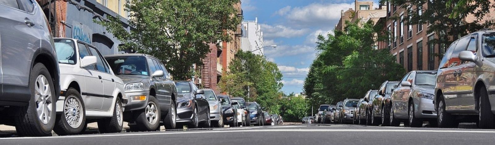 Cars parked on both sides of the street