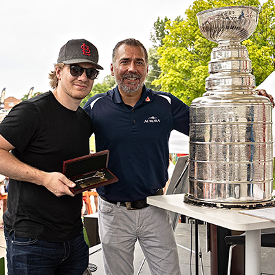 Robert Thomas and Mayor Tom Mrakas, with the Stanley Cup Robert Thomas and Mayor Tom Mrakas, outdoors posing with the Stanley Cup