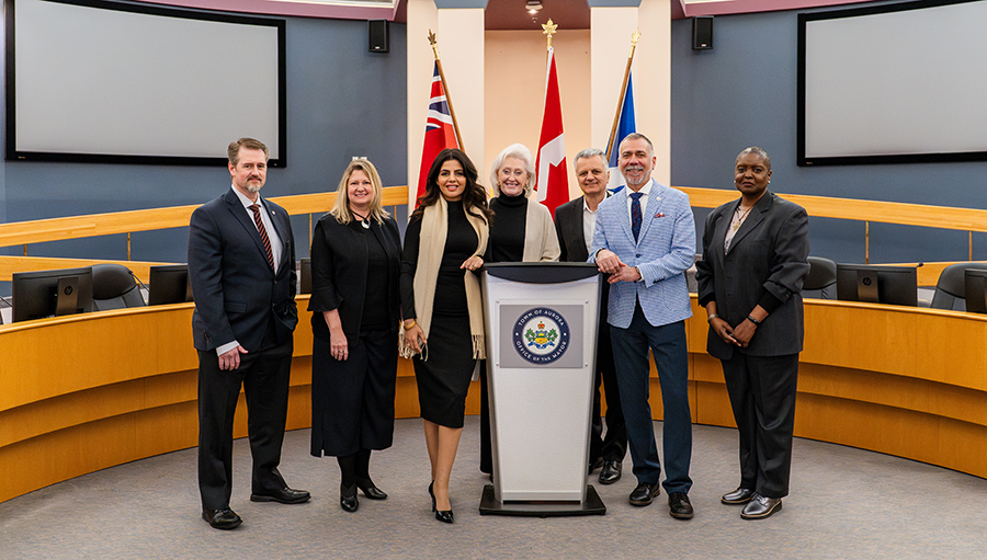 Consul General Younis and Aurora Leadership posing in the Council Chambers