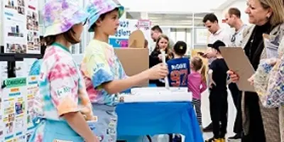 Youth teens displaying innovations at fair