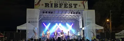 Night view of Ribfest band stage musicians concerts during evening concert