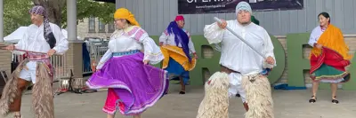 Multicultural dancers on stage at event