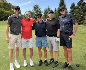 Five men on a golf course