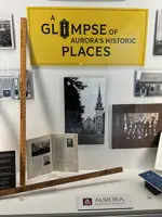 Pictures and other artifacts behind a glass display