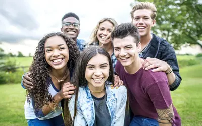 Six teens outdoors in fall season