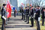 Men in uniform during Remembrance Day standing at attention