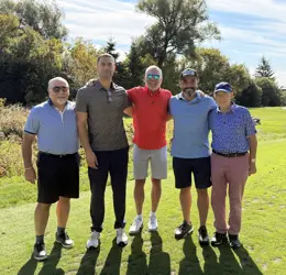 Five men on a golf course