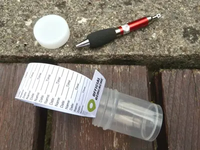 Geocache image on location of paper, pen and cup
