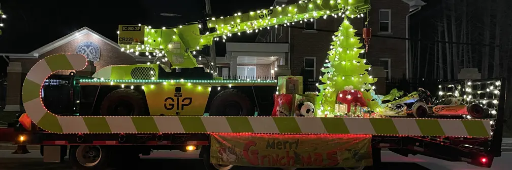 Wide truck decorated in green with Grinch theme