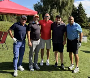 Five men on a golf course