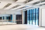 Dance studio with dance bars and large windows