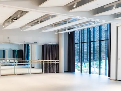 Dance studio with dance bars and large windows