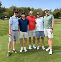 Five men on a golf course