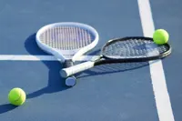 Tennis Rackets and Balls on Court