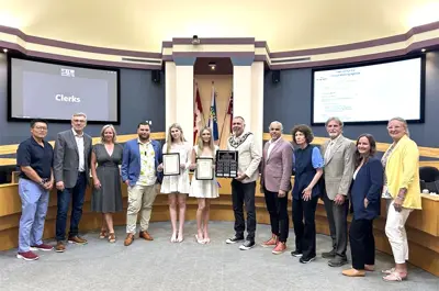 Council and Town staff members presenting winners with their scholarships