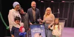 Mayor presenting family with winning prize for naming zamboni
