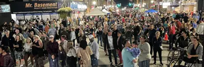 Large group of people on street at Saturday Night Fever event