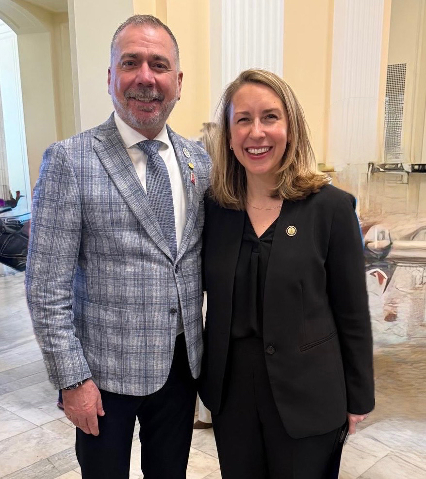 Mayor posing for a picture beside another person