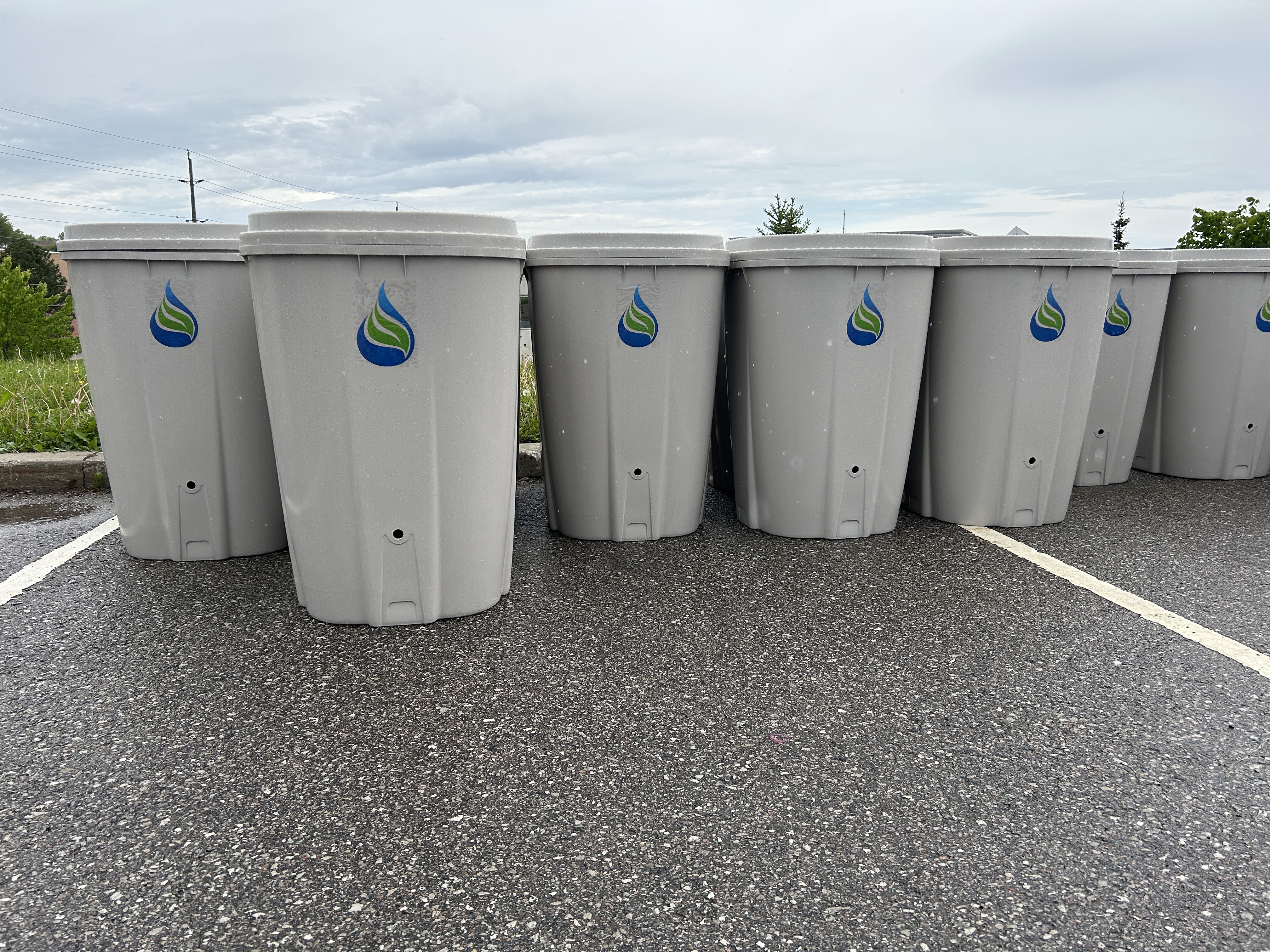 Image of rain barrels in a line