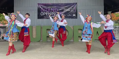 Group of dancers on stage performing cultural dance