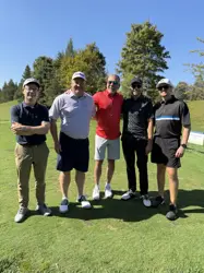 Five men on a golf course