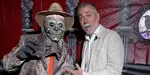 Mayor Tom Mrakas posing with scary Halloween themed skeleton man