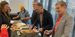 Mayor and Council serving food to event attendees